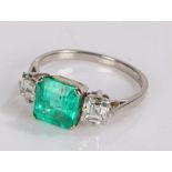 Platinum emerald and diamond set ring, the central certificated natural Columbian emerald at 2.02