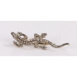 Diamond set brooch, in the form of a lizard, set with an estimated 0.30 carats, 45mm long