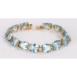 9 carat gold blue zircon set bracelet, with a row of zircons to the bracelet with clasp end, 18cm