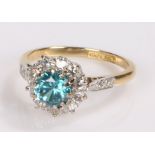 Platinum zircon and diamond set ring, the central zircon at 1.28 carat with a diamond surround, ring