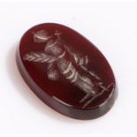 Loose agate seal, the intaglio with a figural design 18mm high