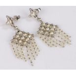 Pair of pearl and diamond set earrings, the drops set with diamonds above the pearl set panel and