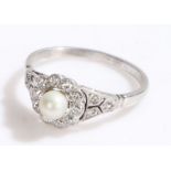 Pearl and diamond set ring, with a central pearl and diamond surround on white metal, ring size O