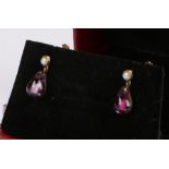 Pair of 9 carat gold earrings, with a pear shaped drop below the pearl, 16mm long
