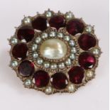 Victorian pearl and garnet brooch, with a central pearl and garnet surround, 30mm diameter