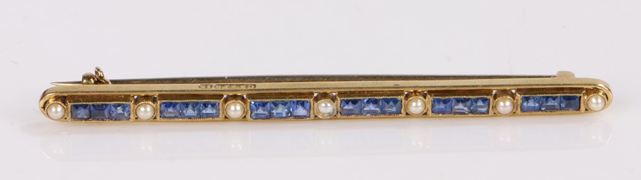 Sapphire and pearl set bar brooch, with a row of sapphires at an estimated 0.75 carats