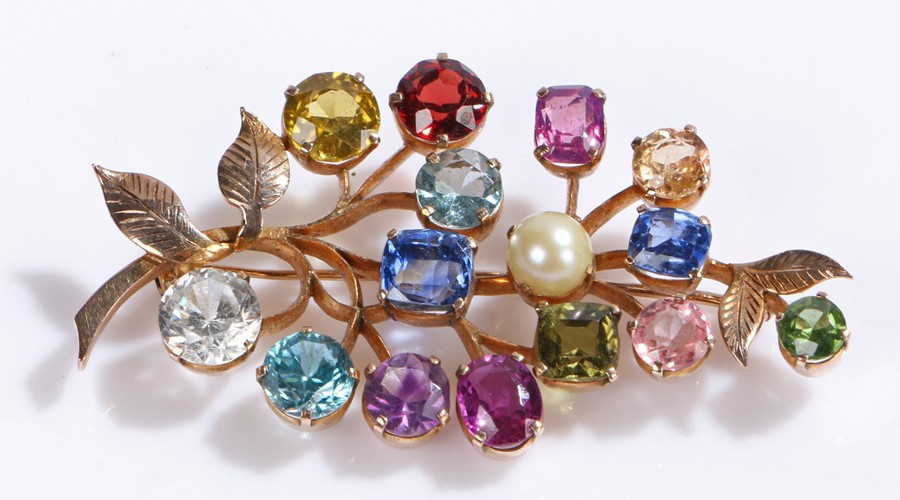 Multi gem stone set brooch, with a spray of coloured stones set to a leaf brooch, 50mm diameter