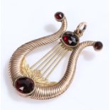 Garnet set pendant, lyre shape set with four garnets, 37mm high