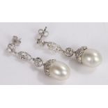 Pair of pearl and diamond set earrings, the drop pearls with diamond set links, the diamonds to be