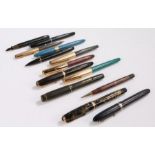 Fountain pens and pencils, to include Watermans, Sheaffer, Parker, five with 14 carat gold nibs (