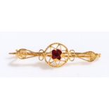 Gold coloured metal brooch set with red paste, 1.9g