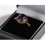 9 carat gold ring set with purple paste, ring size U1/2, 2.9g