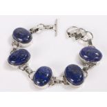 Lapis lazuli and silver bracelet, formed from five oval lapis lazuli panels