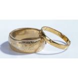 Two gilt bangles with foliate decoration (2)