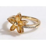 9 carat gold ring, with five oval yellow stones set in a star formation, ring size L1/2, 3.2g