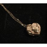 9 carat gold locket, of heart form with depiction of two hands holding a heart, on a necklace, 1.6g