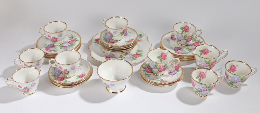 Royal Stafford Carousel pattern part tea service, consisting of nine teacups, twelve saucers, twelve