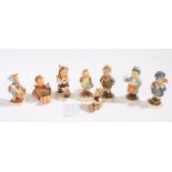 Collection of eight Goebel figures, to include 'Little Gardener', 'School Boy', 'Lets Sing', '