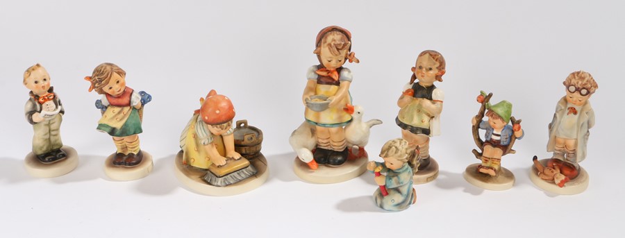 Collection of eight Goebel Hummel figures, to include Doctor, Big House Cleaning, Apple Tree Boy,