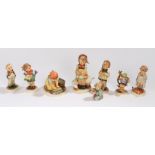 Collection of eight Goebel Hummel figures, to include Doctor, Big House Cleaning, Apple Tree Boy,