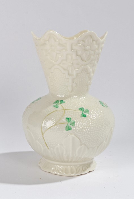 Belleek porcelain vase, with moulded stylised foliate and green leaf decoration, 15cm high
