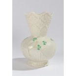 Belleek porcelain vase, with moulded stylised foliate and green leaf decoration, 15cm high