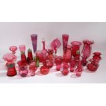 Extensive collection of cranberry glass, consisting of glasses, vases, jugs, salt and pepper set,