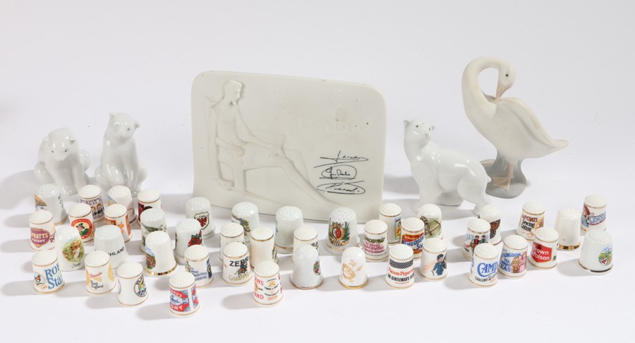 Four Lladro figures, three polar bears and a goose, together with a Lladro plague, a collection of