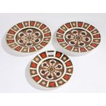 Three Royal Crown Derby Imari pattern plates, two 26.5cm diameter, one 22cm diameter (3)