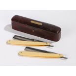 Cased pair of 19th Century straight razors, the leather clad box with silk liner for Taylors, with
