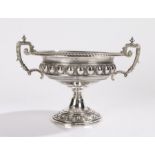 Swiss silver dish, the twin angular handles with scroll decoration, the gadrooned rim above a scroll