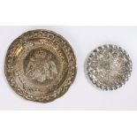 Two Portuguese silver dishes, one with central double eagle crest surrounded by a scroll and foliate