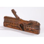 19th Century moulding plane with carved stylised leaf and crescent decoration, 27cm wide