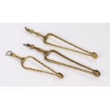 Three pairs of George III brass ember tongs, two with ring turned handles and another pair with wavy