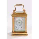Gilt brass miniature carriage clock, with putti enamel porcelain panels to the case, the dial with