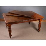 Edwardian mahogany extending dining table, the rectangular top with two additional leaves above