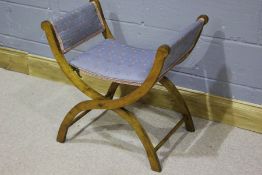 Early 20th Century folding stool, the walnut folding frame with an upholstered seat, with a patent