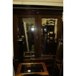 Victorian mahogany wardrobe, the stepped pediment above two bevelled mirror doors, and two