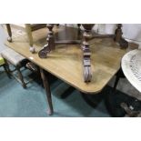 Early 20th Century mahogany drop leaf table, the rectangular top supported by saber type legs, 109cm