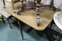 Early 20th Century mahogany drop leaf table, the rectangular top supported by saber type legs, 109cm