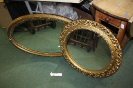 Oval gilt framed bevelled glass mirror, together with a circular gilt framed mirror (2)