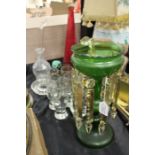 Green glass lustre with hanging clear prismatic drops, glassware to include lemon juicer, storage