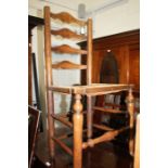 19th Century elm ladder back dining chair, the back with four splats above a cane seat, raised on