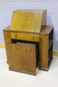 1930's walnut veneered bureau, the fall opening to reveal a tooled leatherette writing surface and