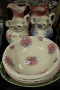 Four porcelain jugs and non-contemporary washbowls, oval meat plate