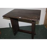 Early 20th Century rustic oak table, the rectangular top raised on two large supports, united by a