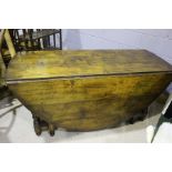 18th Century style oak gate leg table, the rectangular top raised on turned legs, united by
