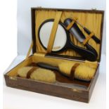 Ebony dressing table set, housed in a silk lined travelling case