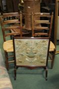 Pair of oak ladder back chairs, together with a fire screen, (3)