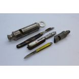 The Acme Scout Master whistle, another whistle smaller and four small penknives (6)